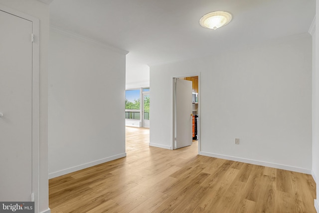 4101 Cathedral Ave NW Unit 1104, Washington, DC 20016 - empty room featuring crown molding, light wood-type flooring, and baseboards