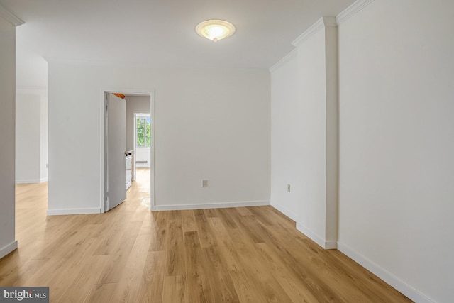 4101 Cathedral Ave NW Unit 1104, Washington, DC 20016 - spare room with crown molding, light wood-style floors, and baseboards