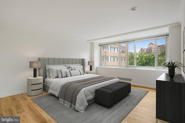 4101 Cathedral Ave NW Unit 1104, Washington, DC 20016 - bedroom with multiple windows, light wood finished floors, and baseboards