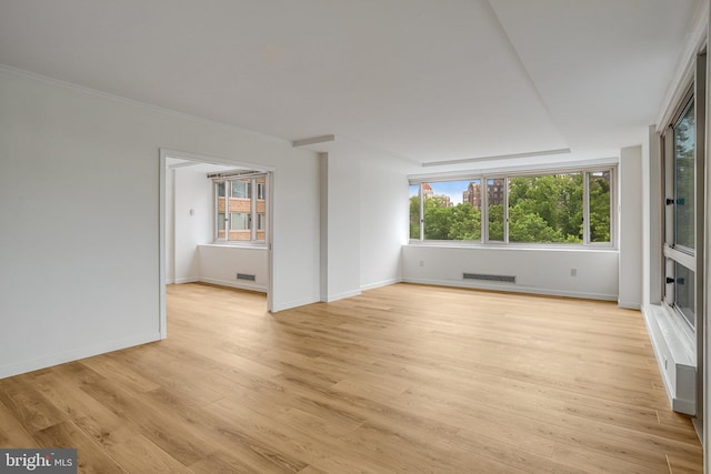 4101 Cathedral Ave NW Unit 1104, Washington, DC 20016 - unfurnished room with light wood-style flooring, plenty of natural light, and baseboards