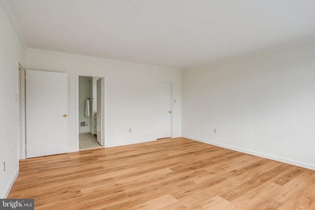 4101 Cathedral Ave NW Unit 1104, Washington, DC 20016 - unfurnished room with ornamental molding, light wood-style floors, and baseboards