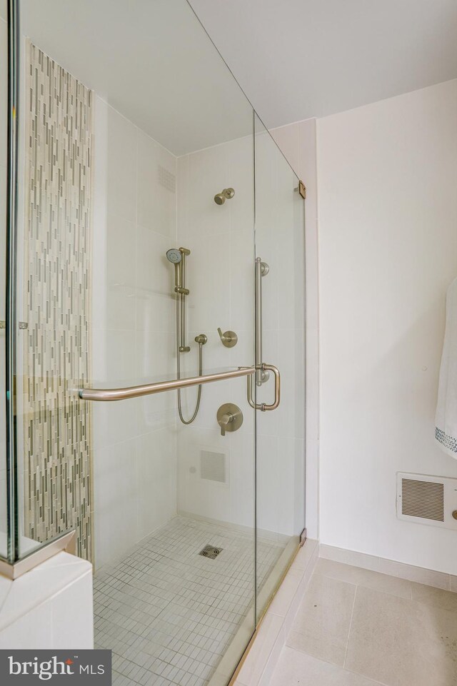 4101 Cathedral Ave NW Unit 1104, Washington, DC 20016 - bathroom with tile patterned floors and a stall shower