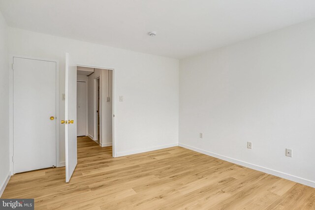 4101 Cathedral Ave NW Unit 1104, Washington, DC 20016 - unfurnished room featuring light wood-style floors, baseboards, and a smoke detector