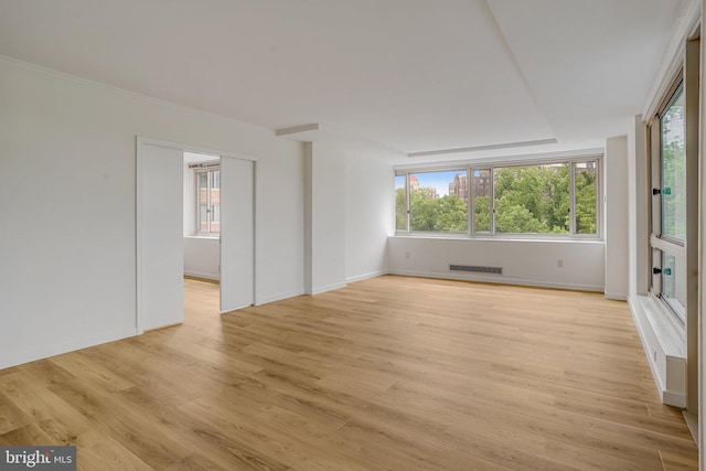 4101 Cathedral Ave NW Unit 1104, Washington, DC 20016 - empty room with plenty of natural light, light wood-style floors, and baseboards