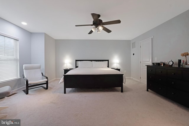 bedroom with light carpet, baseboards, and visible vents