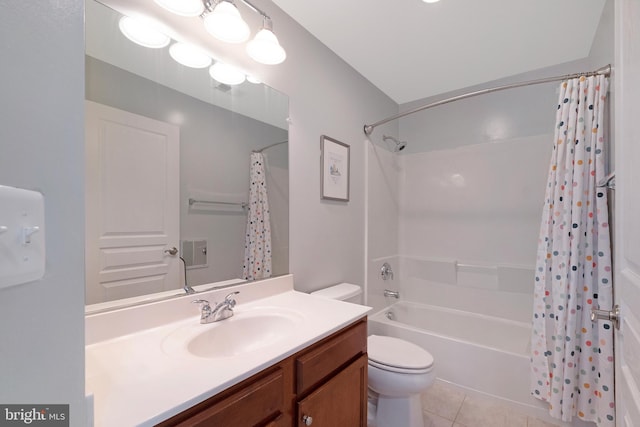 bathroom featuring tile patterned flooring, vanity, shower / bath combination with curtain, and toilet