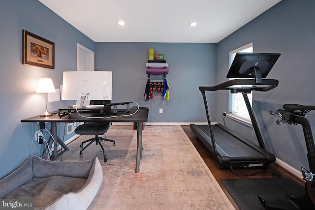 office space with baseboards, recessed lighting, and wood finished floors