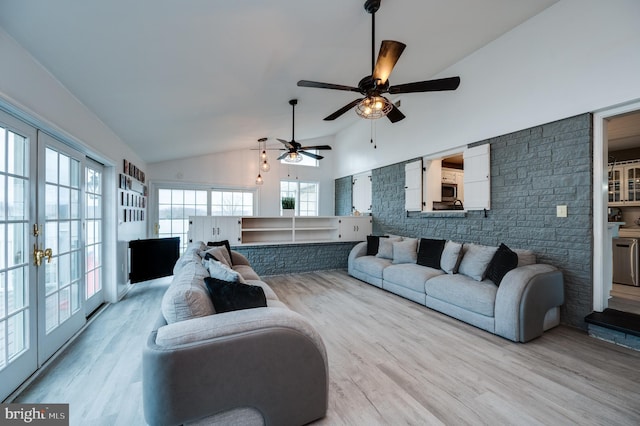 living room with high vaulted ceiling, a ceiling fan, and wood finished floors