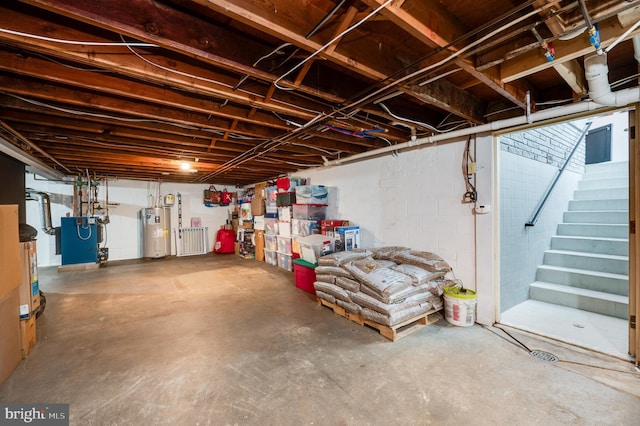 unfinished below grade area featuring stairway, a heating unit, and electric water heater