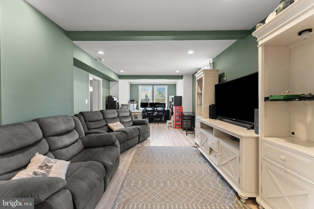 living room featuring light wood finished floors and recessed lighting