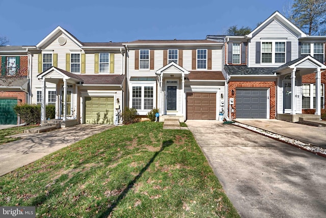 townhome / multi-family property featuring brick siding, a garage, and driveway