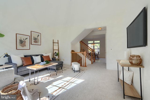 carpeted living room with stairway