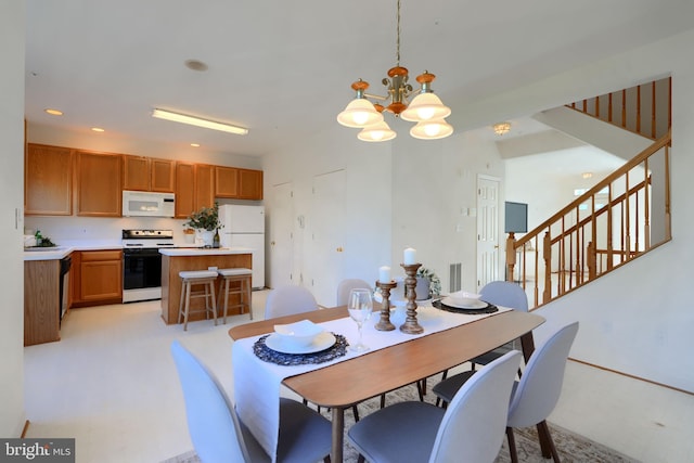 dining space with stairway, recessed lighting, and an inviting chandelier