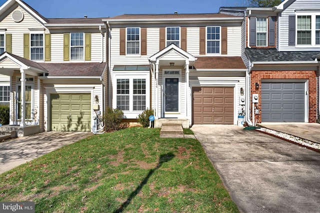 multi unit property featuring driveway, a front lawn, and a garage