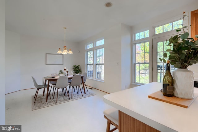 dining room featuring a notable chandelier and visible vents