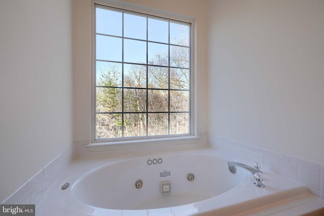 full bathroom featuring a whirlpool tub