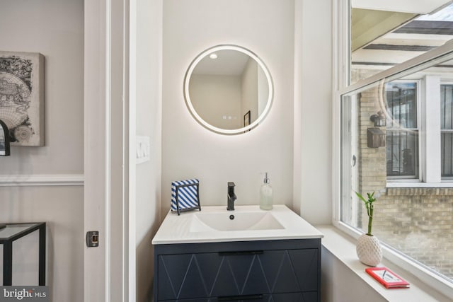 bathroom featuring plenty of natural light and vanity
