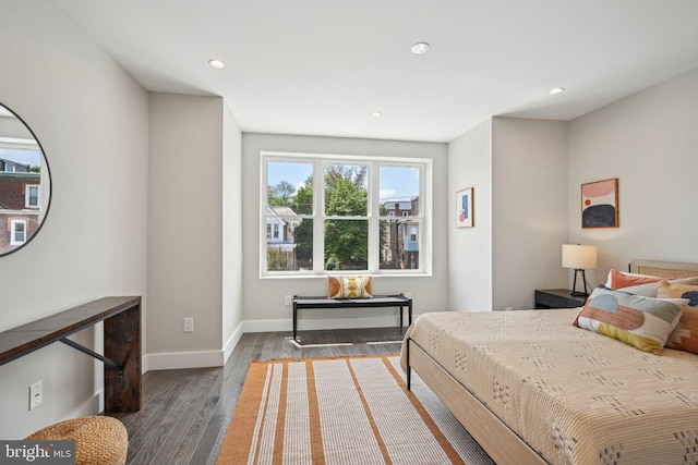 bedroom with recessed lighting, baseboards, and wood finished floors