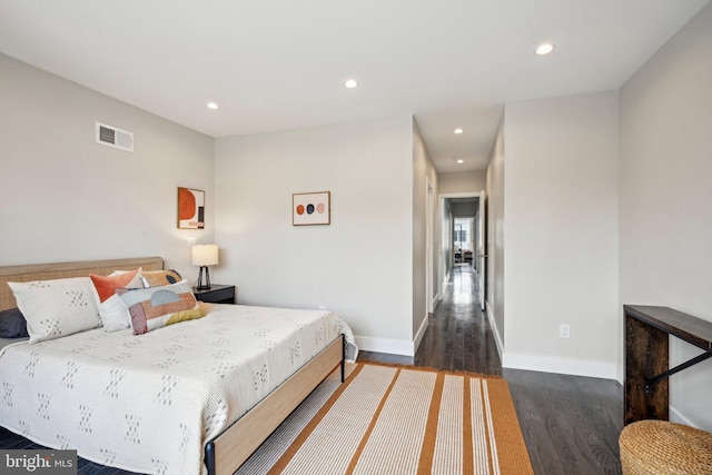 bedroom with recessed lighting, baseboards, visible vents, and wood finished floors