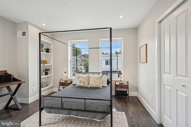 bedroom featuring dark wood-style flooring, recessed lighting, and visible vents