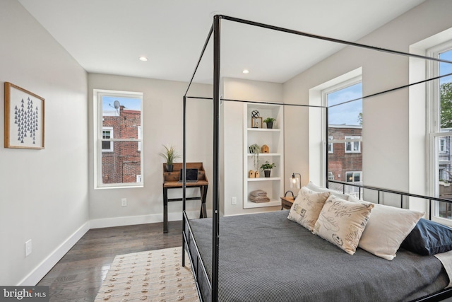bedroom with recessed lighting, baseboards, and dark wood finished floors
