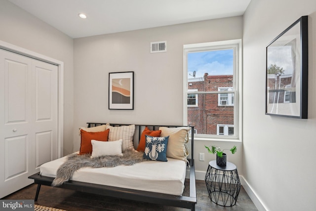 bedroom featuring baseboards, recessed lighting, dark wood finished floors, and visible vents