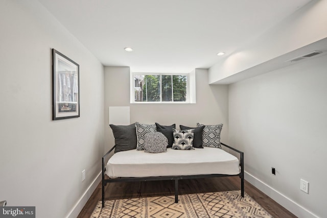 sitting room with visible vents, wood finished floors, baseboards, and recessed lighting