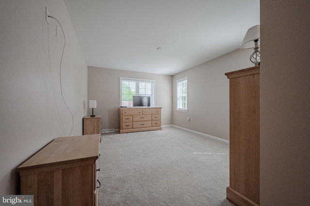 carpeted bedroom featuring baseboards