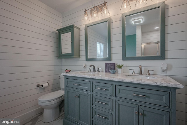 full bathroom featuring a sink and wooden walls