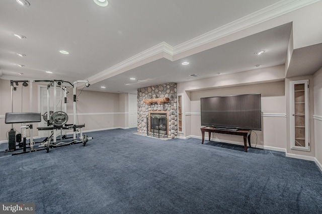 workout room featuring baseboards, ornamental molding, recessed lighting, and a fireplace