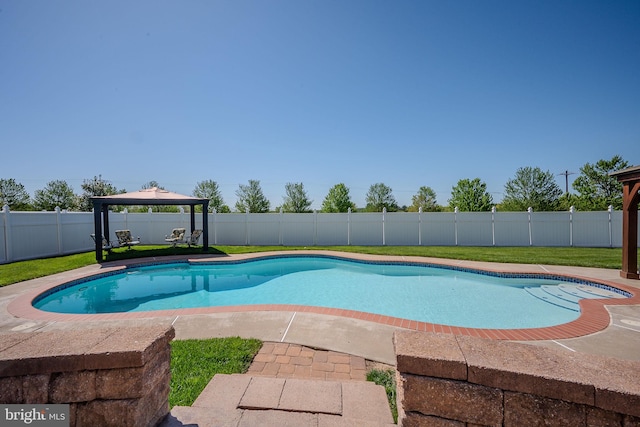 view of swimming pool featuring a fenced in pool, a gazebo, and a fenced backyard
