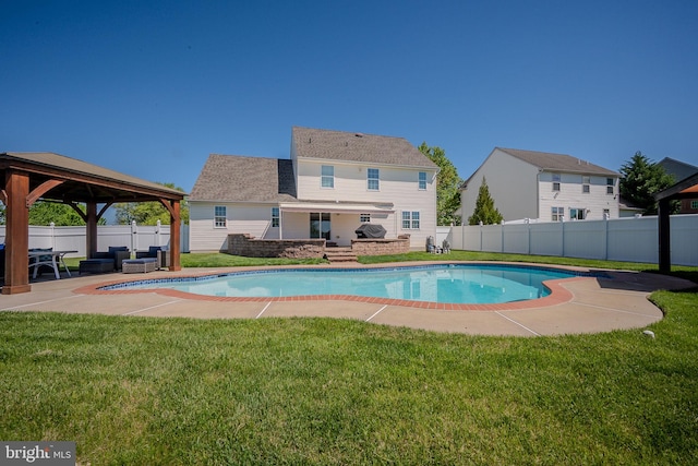 view of pool featuring a gazebo, a fenced backyard, a yard, and a fenced in pool