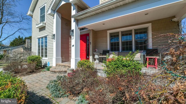 doorway to property featuring a porch
