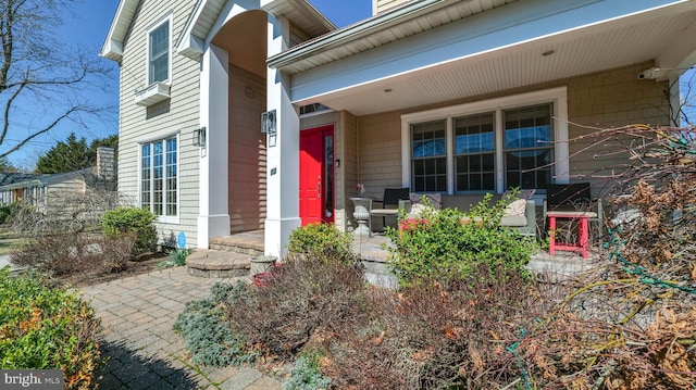 property entrance featuring covered porch