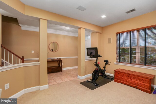 exercise room featuring visible vents, baseboards, carpet, and tile patterned flooring