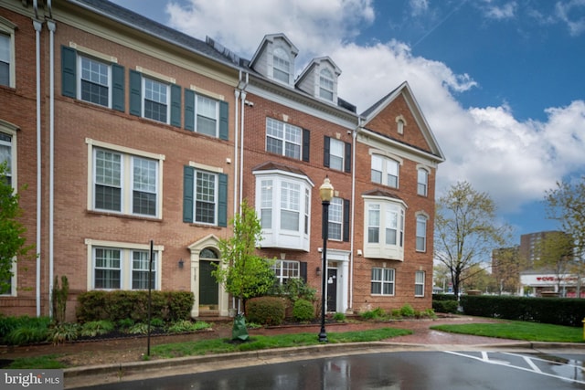 view of front of home with brick siding