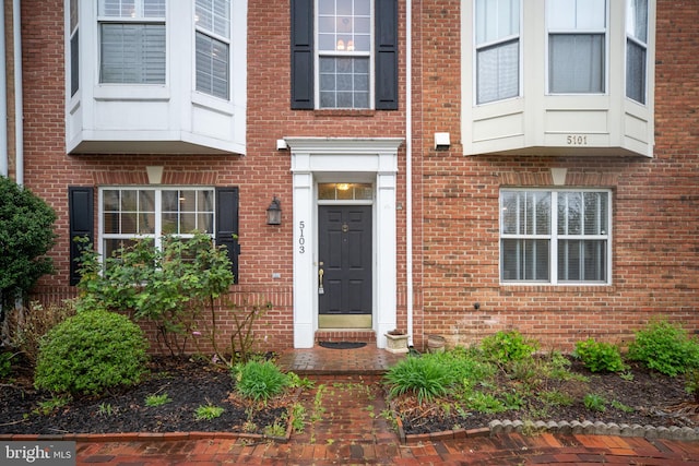 entrance to property with brick siding