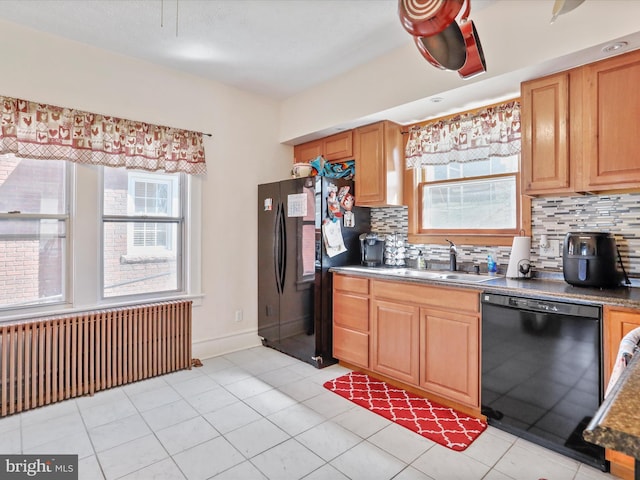 433 Williams St, Cumberland, MD 21502 - kitchen featuring radiator heating unit, a healthy amount of sunlight, a sink, and black appliances