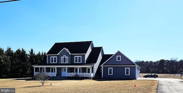 view of front of home featuring a porch and a front yard
