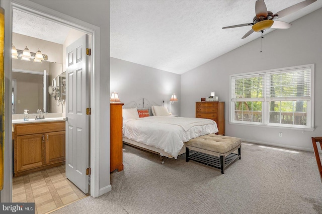 9 Edgewood Dr, Ocean Pines, MD 21811 - bedroom featuring a textured ceiling, light carpet, a sink, and lofted ceiling
