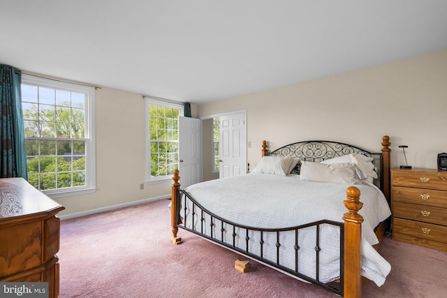 bedroom featuring baseboards and carpet flooring