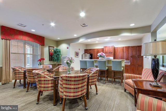 dining space featuring recessed lighting and visible vents