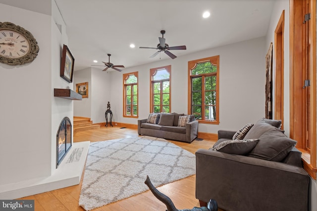 4544 30th St NW, Washington, DC 20008 - living area with recessed lighting, ceiling fan, baseboards, a glass covered fireplace, and light wood-style floors