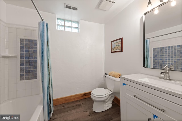4544 30th St NW, Washington, DC 20008 - full bathroom featuring toilet, visible vents, vanity, wood finished floors, and shower / bath combo