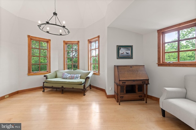 4544 30th St NW, Washington, DC 20008 - living area featuring vaulted ceiling, an inviting chandelier, baseboards, and light wood-type flooring