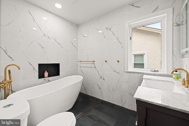 4544 30th St NW, Washington, DC 20008 - full bathroom with tile walls, toilet, marble finish floor, a soaking tub, and vanity