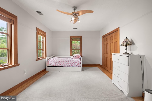4544 30th St NW, Washington, DC 20008 - bedroom with baseboards, a closet, visible vents, and multiple windows