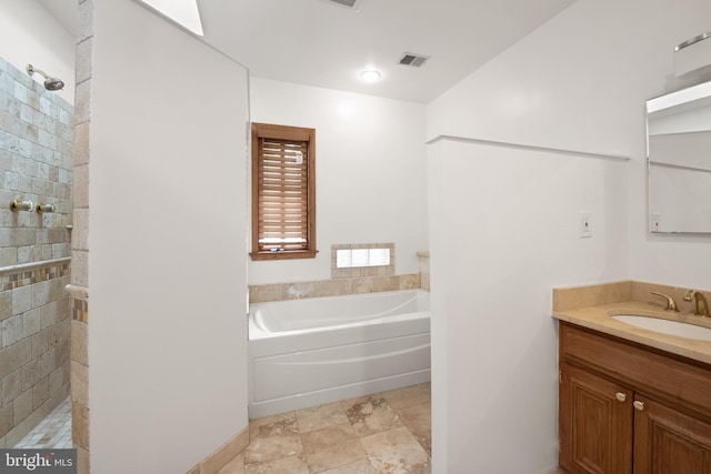 4544 30th St NW, Washington, DC 20008 - bathroom with a garden tub, vanity, visible vents, and a walk in shower
