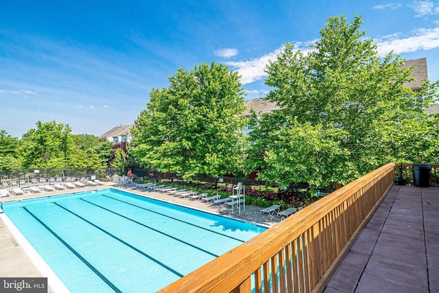 11575 Cavalier Landing Ct Unit 402, Fairfax, VA 22030 - community pool with a patio area and fence
