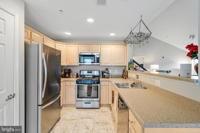 11575 Cavalier Landing Ct Unit 402, Fairfax, VA 22030 - kitchen with a sink, a peninsula, appliances with stainless steel finishes, and light brown cabinetry